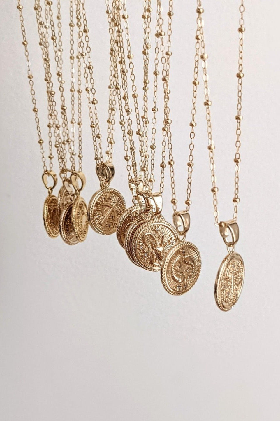 Gold Zodiac Coin Necklaces by Layer the Love