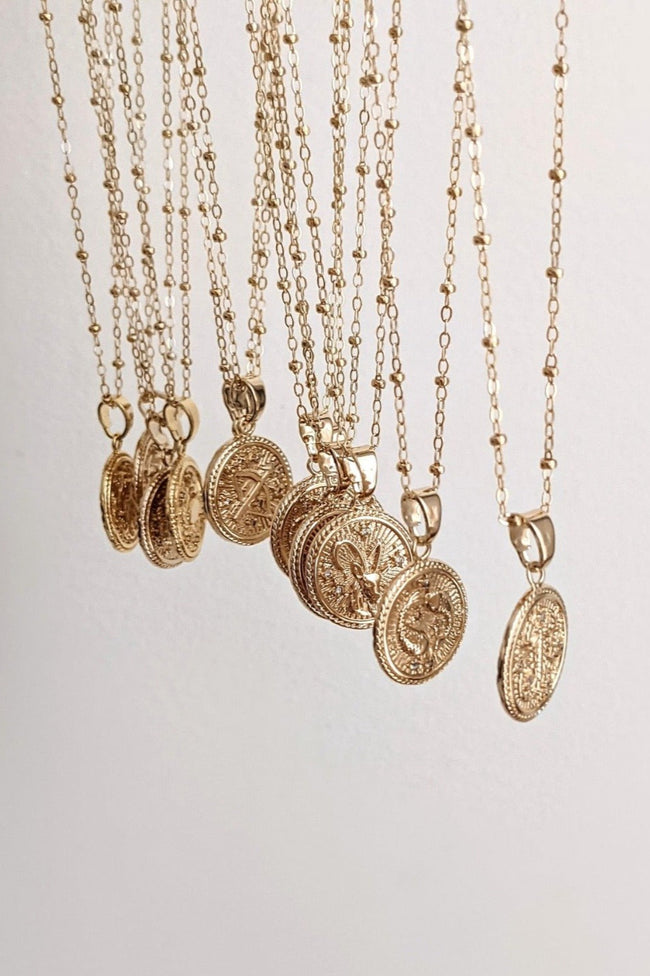 Gold Zodiac Coin Necklaces by Layer the Love