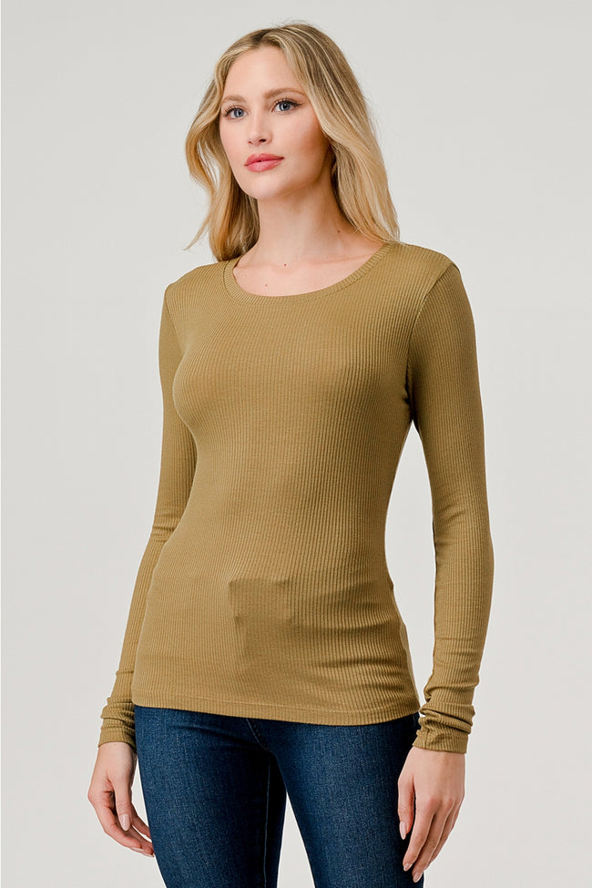 Woman wearing a brown long-sleeve top on a plain background