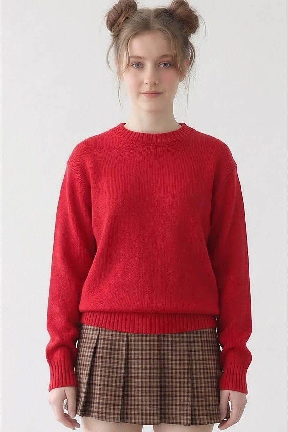 Person wearing a red sweater and plaid skirt on a white background