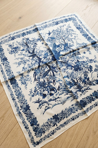 Blue and white floral patterned fabric on a wooden surface