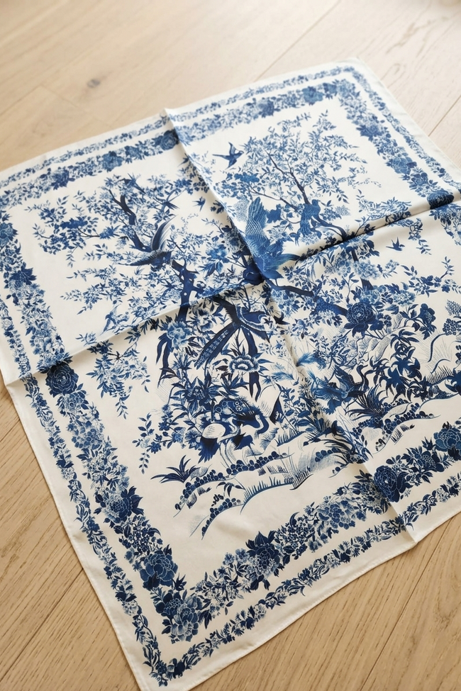 Blue and white floral patterned fabric on a wooden surface