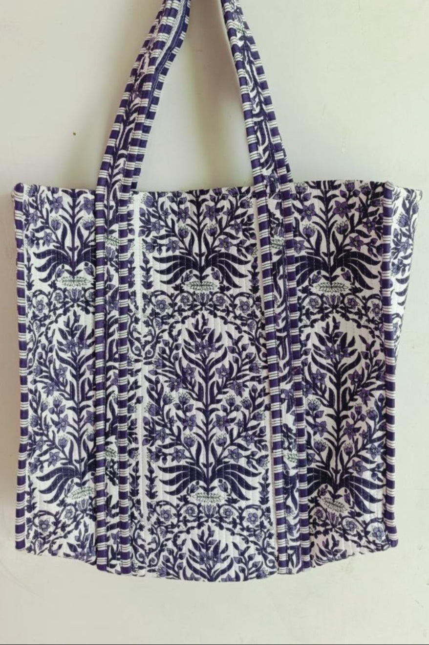 Tote bag with blue and white pattern on a light background