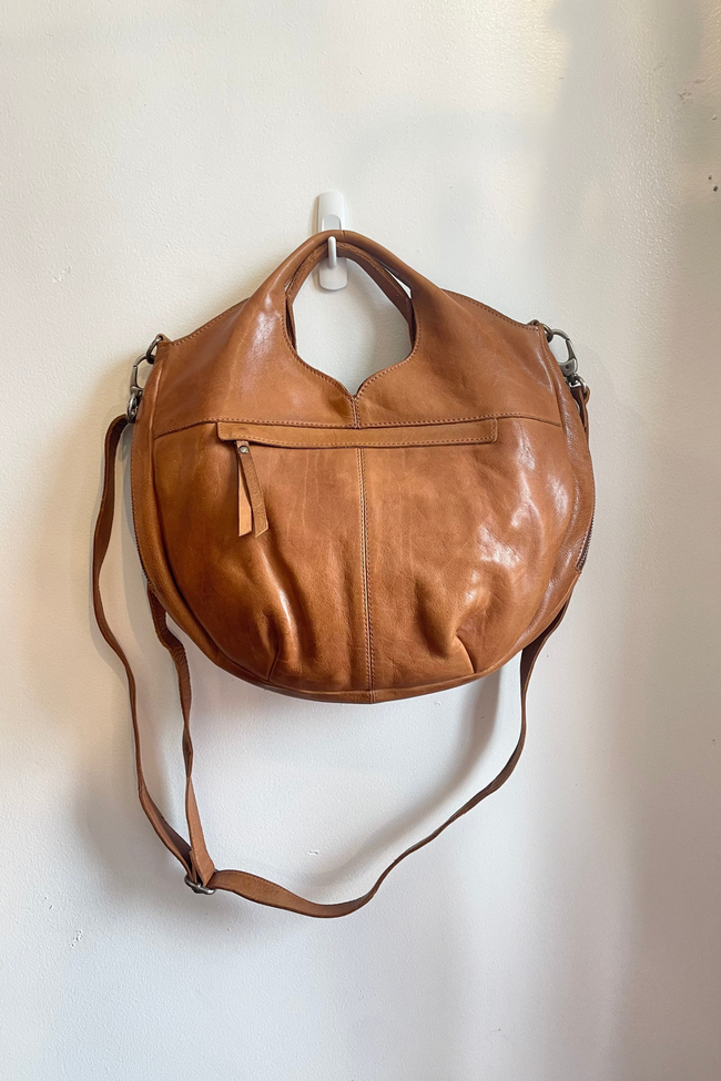 Brown leather handbag on a white background