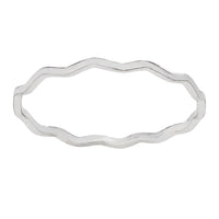 Silver ring with wavy band design on a white background