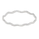 Silver ring with wavy band design on a white background
