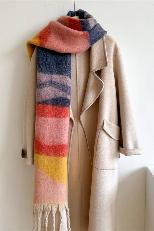 Beige coat with a colorful striped scarf on a white background