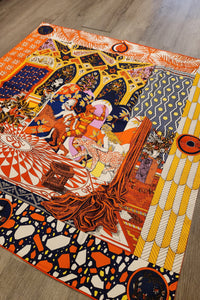 Colorful abstract patterned scarf on a wooden floor