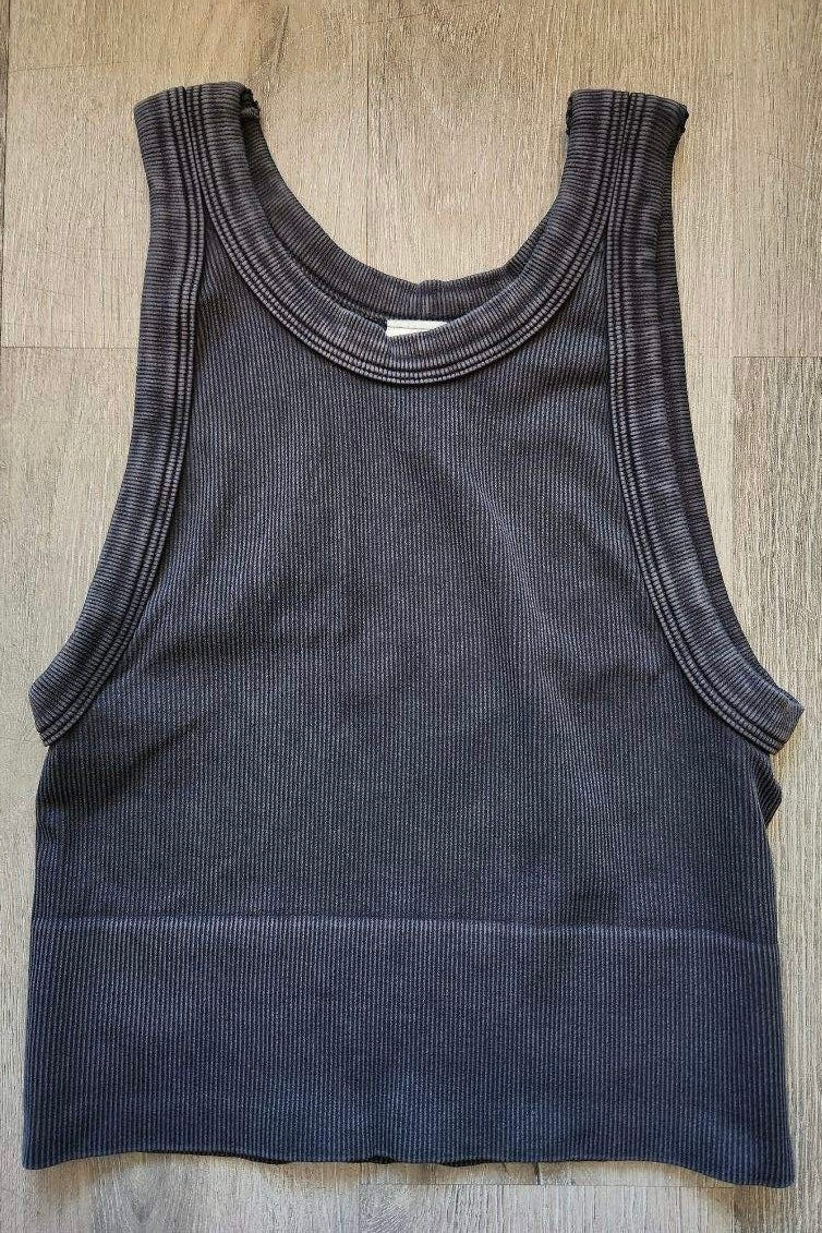 Black ribbed tank top on a wooden surface