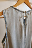 back button keyhole detail on a denim sleeveless dress